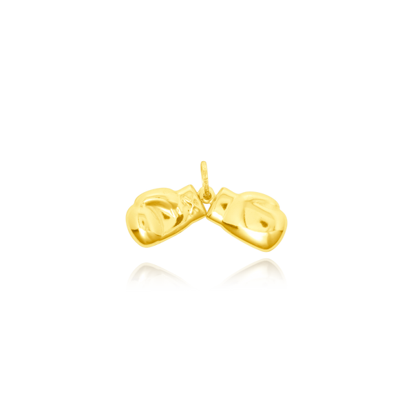 Pendentif en forme de Paire de Gants de boxe en Or Jaune 18 Carats - 750/000.     CARACTERISTIQUES :  Hauteur x Largeur (mm) : 15 x 10.01 (le gant) Poids (gr) : 2.19 Matière : Or 18 Carats - 750/000 18697 