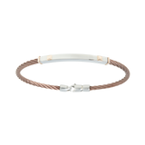 Jonc 1 câble Acier PVD, serti de 2 motifs et de 2 inserts en Or Rose massif 18 Carats - 750/000.  Qu'il soit classique ou fantaisiste, le bracelet saura sans conteste faire plaisir.  CARACTERISTIQUES :  Largeur jonc (mm) : 4.00 Diamètre jonc (cm) : 6.50 Matière : Acier et Or 18 Carats - 750/000 Couleur câble : PVD Bleu, PVD Chocolat Matière : 19519-19518