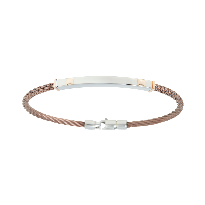 Jonc 1 câble Acier PVD, serti de 2 motifs et de 2 inserts en Or Rose massif 18 Carats - 750/000.  Qu'il soit classique ou fantaisiste, le bracelet saura sans conteste faire plaisir.  CARACTERISTIQUES :  Largeur jonc (mm) : 4.00 Diamètre jonc (cm) : 6.50 Matière : Acier et Or 18 Carats - 750/000 Couleur câble : PVD Bleu, PVD Chocolat Matière : 19519-19518