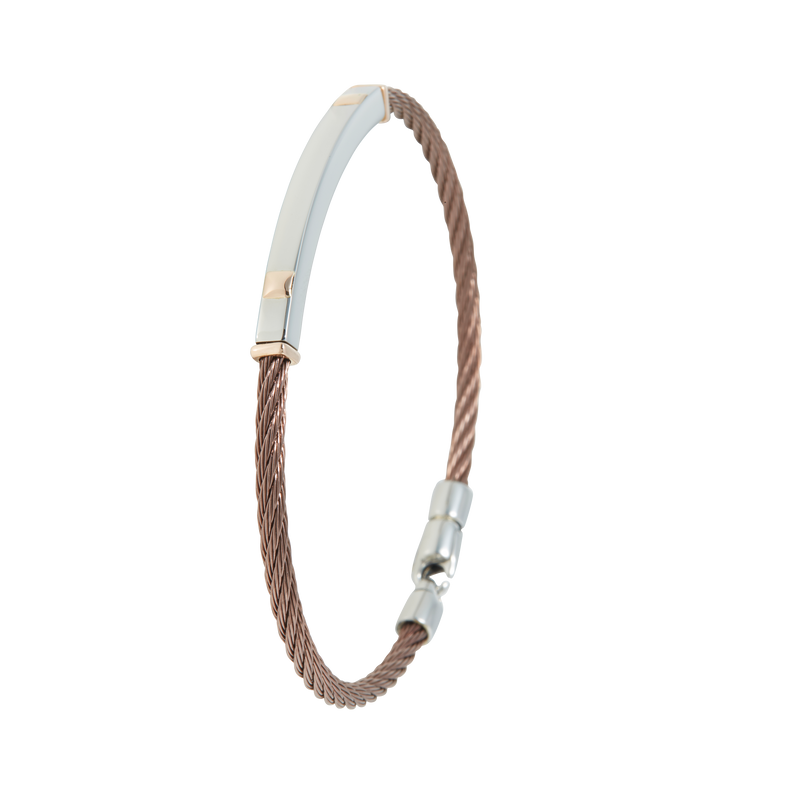 Jonc 1 câble Acier PVD, serti de 2 motifs et de 2 inserts en Or Rose massif 18 Carats - 750/000.  Qu'il soit classique ou fantaisiste, le bracelet saura sans conteste faire plaisir.  CARACTERISTIQUES :  Largeur jonc (mm) : 4.00 Diamètre jonc (cm) : 6.50 Matière : Acier et Or 18 Carats - 750/000 Couleur câble : PVD Bleu, PVD Chocolat Matière : 19519-19518