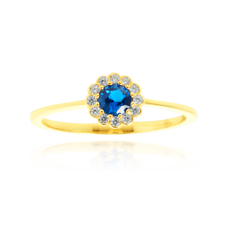 Solitaire rond serti d'un zirconium central bleu, couronné de zirconiums en forme de fleur, en Or Jaune 18 carats 750/000   CARACTERISTIQUES :  Motif central (mm) : 7.0 Epaisseur (mm) : 1.32 Poids (gr) : 1.66        Matière : Or 18 Carats - 750/000 20040